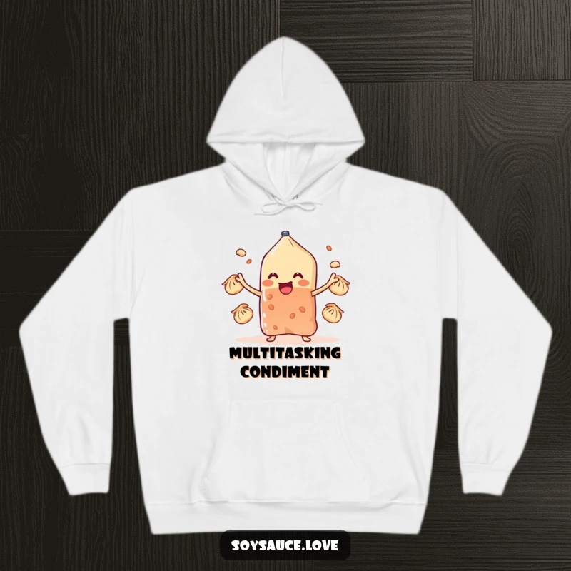 Funny soy sauce sachet character juggling dumplings with stubby arms, featured on a warm hoodie, offering comfort and humor.